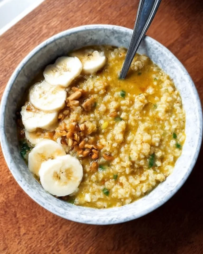Delicious bowl of high-protein savory oatmeal topped with fresh herbs and vegetables