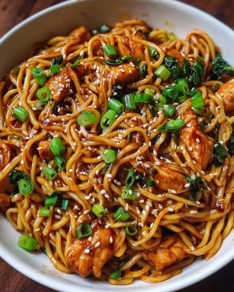 Delicious sticky garlic chicken noodles served in a bowl