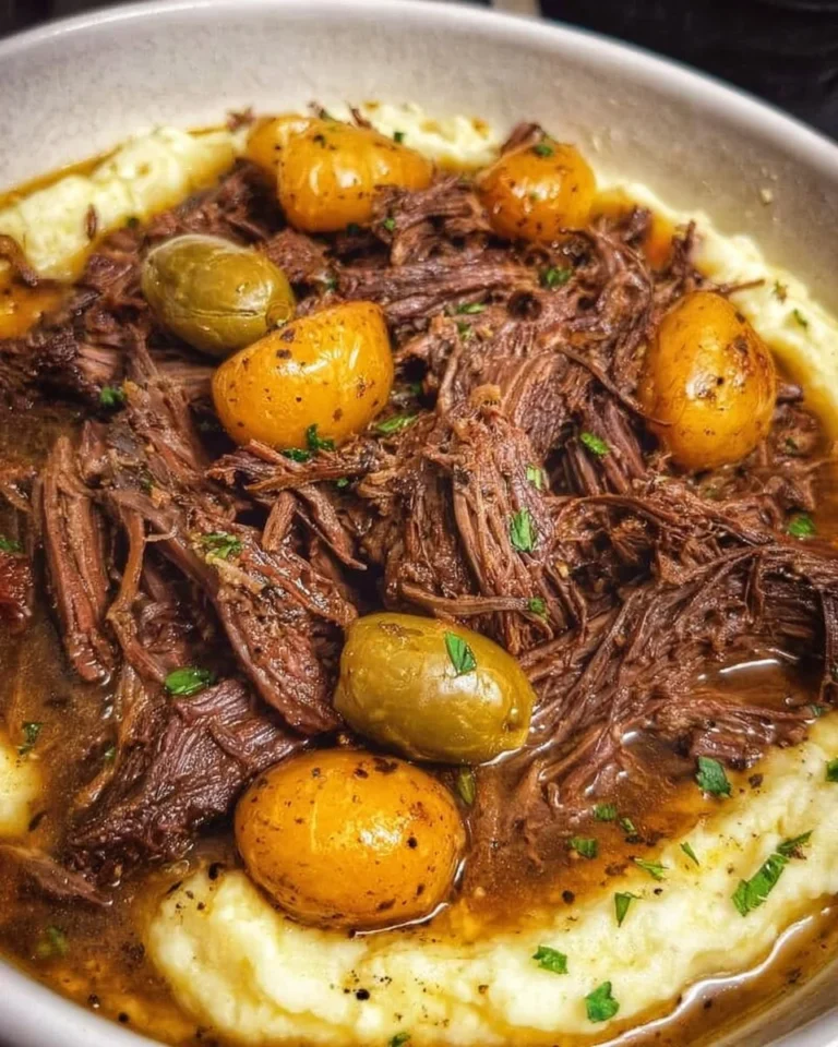 Crockpot Mississippi Pot Roast served with vegetables on a plate
