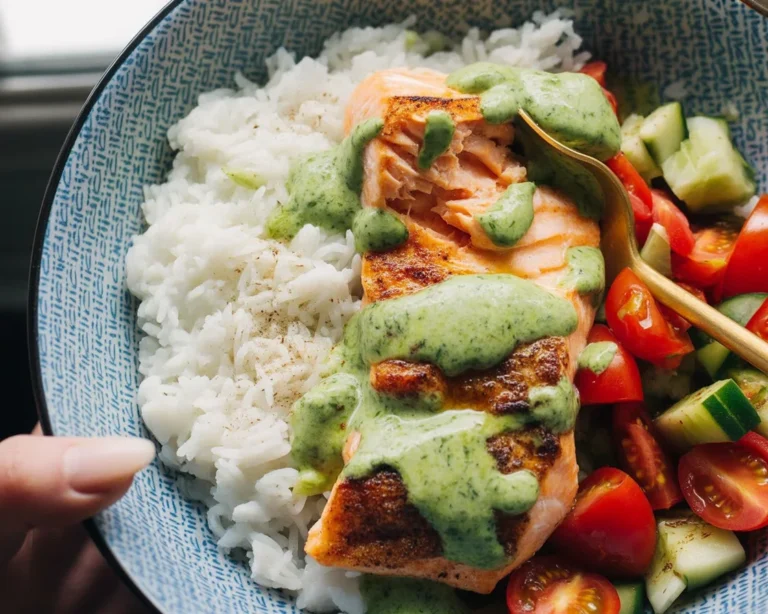 Delicious Salmon with Basil Sauce and Tomato Salad, featuring fresh ingredients.